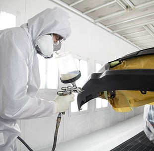 Collision Center Technician Painting a Vehicle | Monken Toyota of Mt. Vernon in Mt Vernon IL