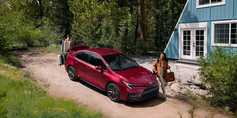A photo of a 2025 Toyota Corolla parked in a driveway.