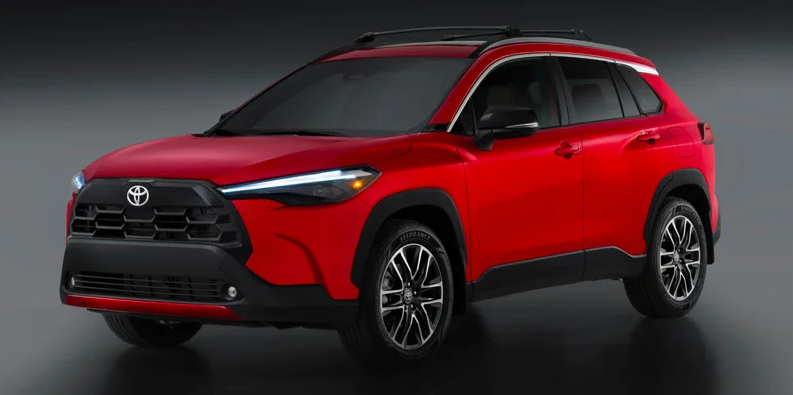 A photo of a red 2026 Toyota Corolla Cross with a black backround.